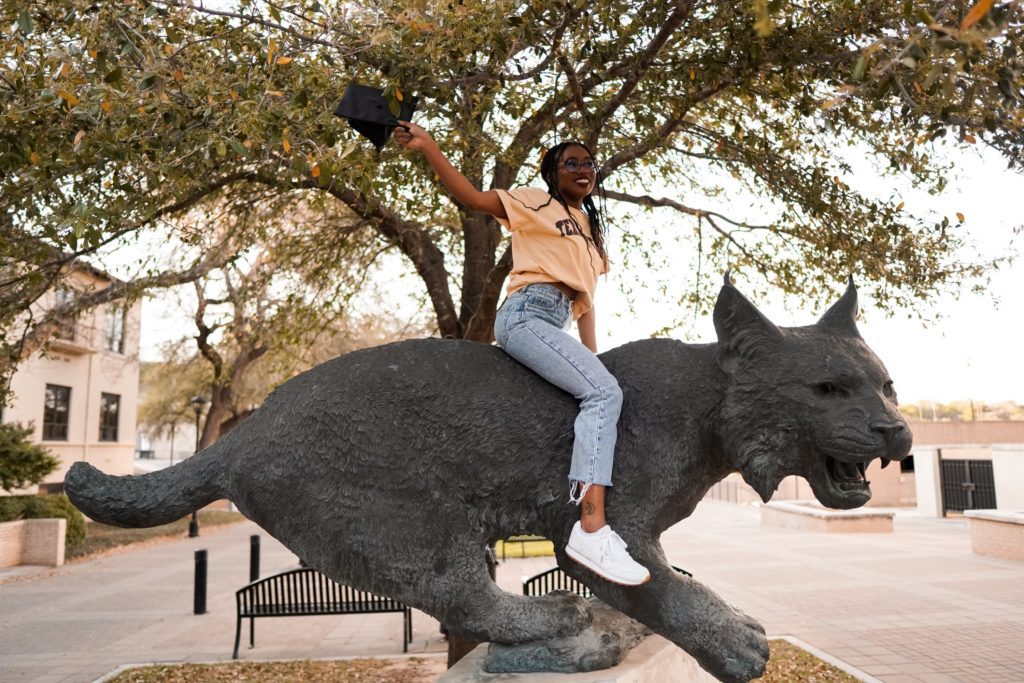 Autumn riding a bobcat